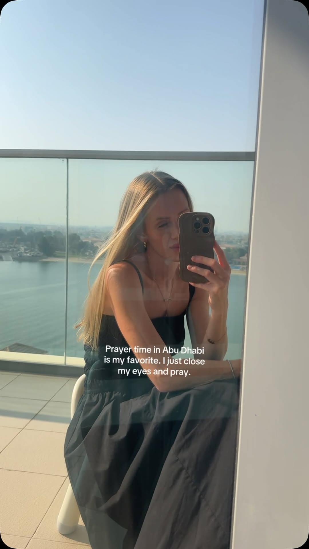 Mirror portrait overlooking Abu Dhabi