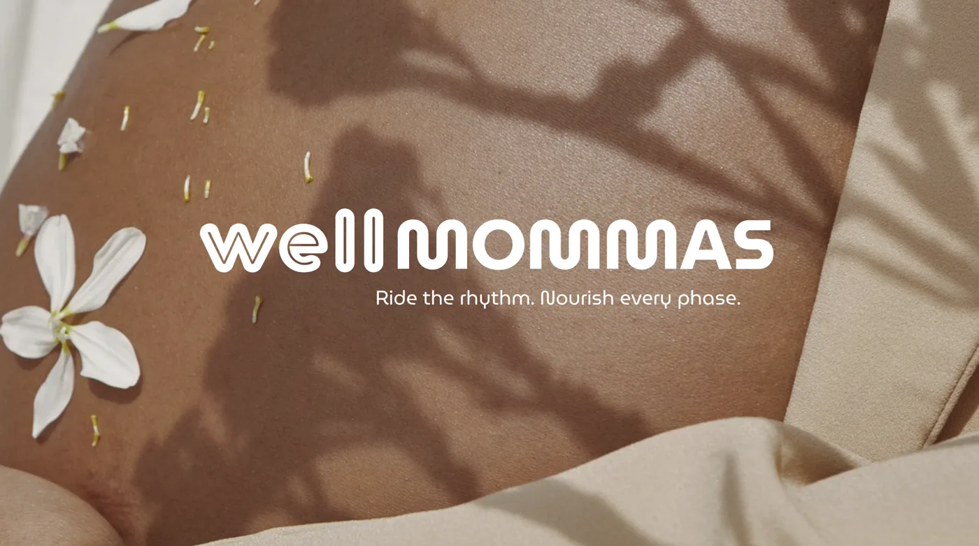 Wellness program for mamas identity artwork with white wordmark on warm brown fabric